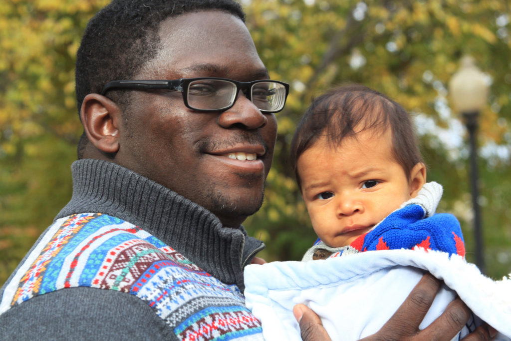 father holding son