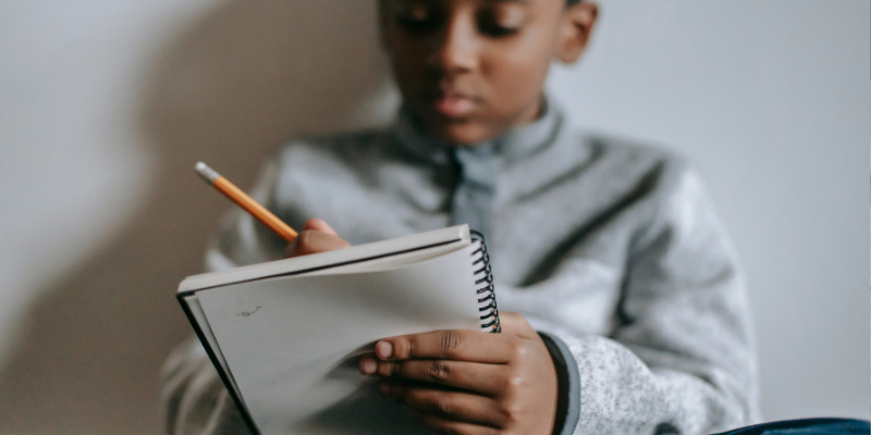 kid writing thank you letters to show appreciation