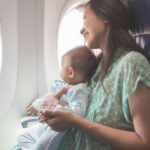 mom and baby traveling in a plane