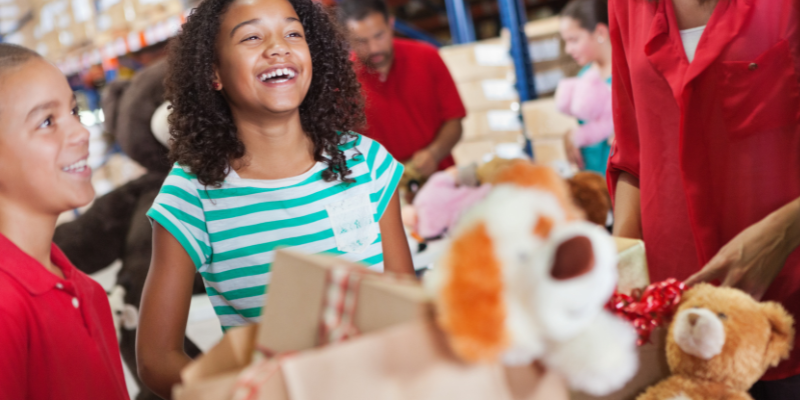 kids donating toys to celebrate boxing day