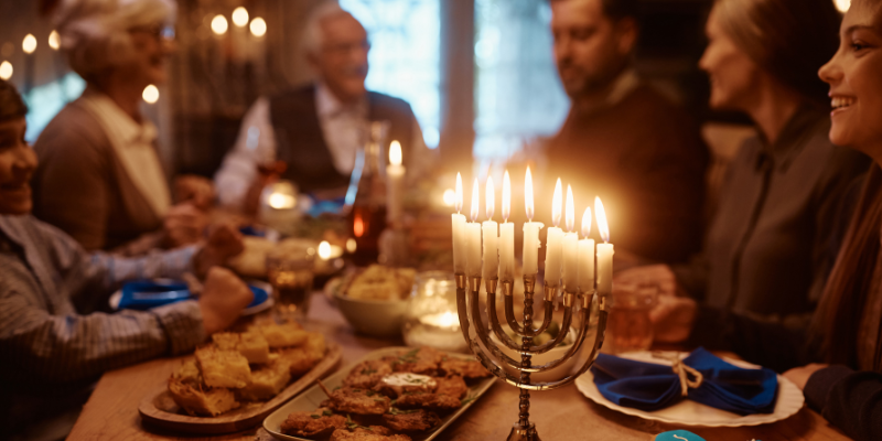 family celebrating hanukkah