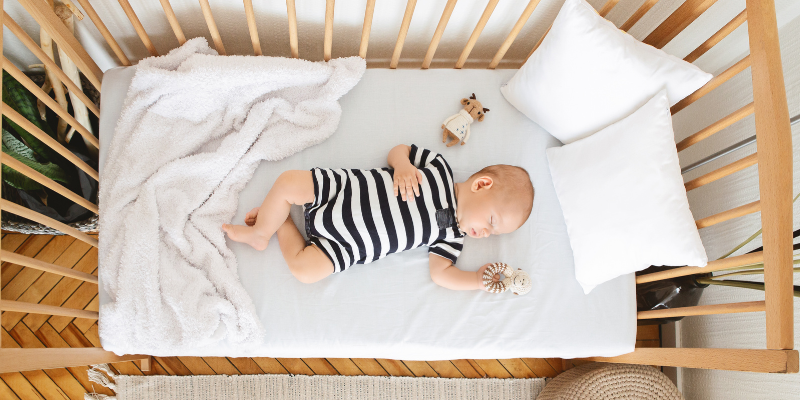 baby taking a nap in crib