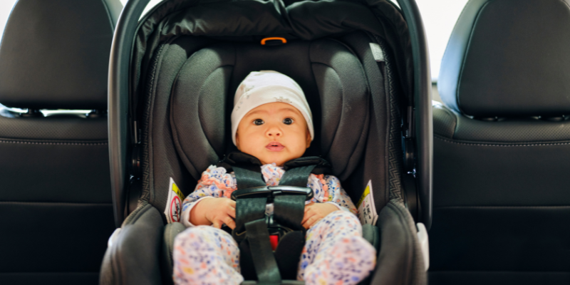 baby traveling safely in carseat