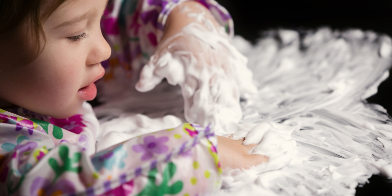 kid playing with bubble foam