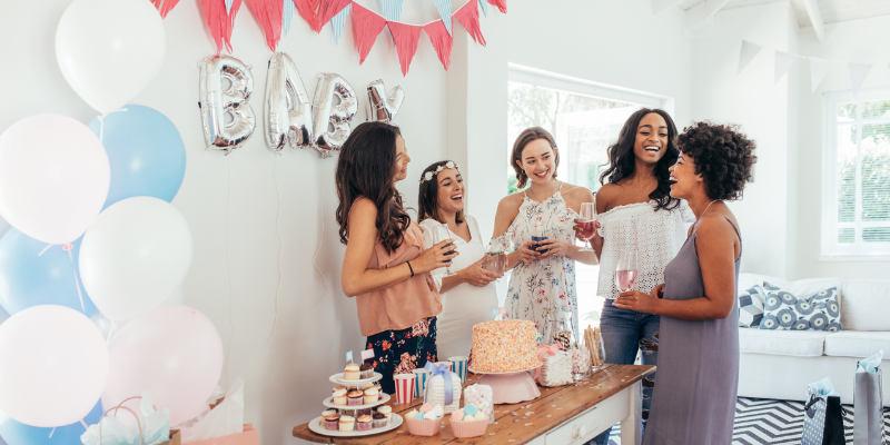women at a baby shower for a rainbow baby